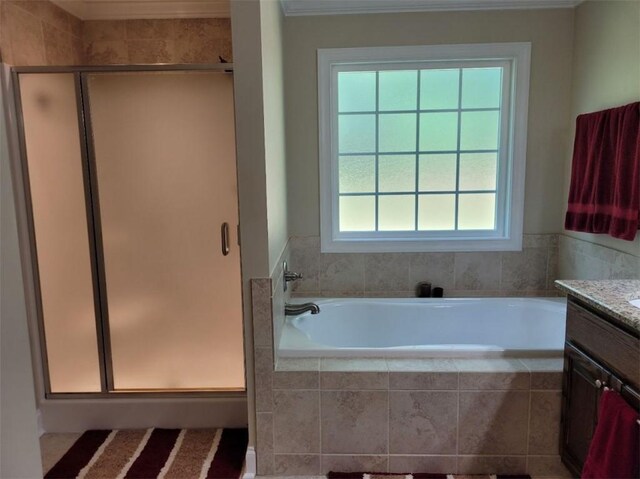 212 Melody Ln, Valley, AL 36854 - bathroom featuring vanity, a shower stall, a bath, and crown molding