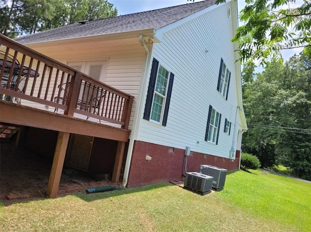 212 Melody Ln, Valley, AL 36854 - view of property exterior featuring a lawn, a deck, crawl space, and roof with shingles