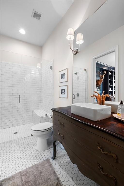 1321 Falls Crest Dr, Auburn, AL 36830 - full bath featuring vanity, visible vents, toilet, a stall shower, and tile patterned floors