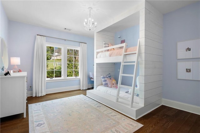 1321 Falls Crest Dr, Auburn, AL 36830 - bedroom featuring a chandelier, visible vents, baseboards, and wood finished floors