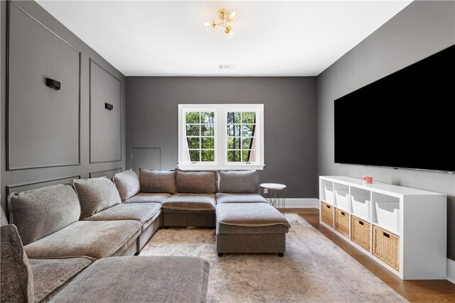 1321 Falls Crest Dr, Auburn, AL 36830 - living room with wood finished floors, baseboards, and visible vents