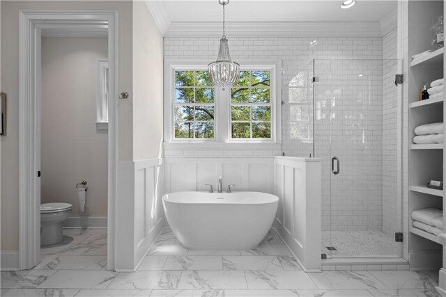 1321 Falls Crest Dr, Auburn, AL 36830 - full bathroom featuring crown molding, toilet, marble finish floor, a freestanding bath, and a stall shower