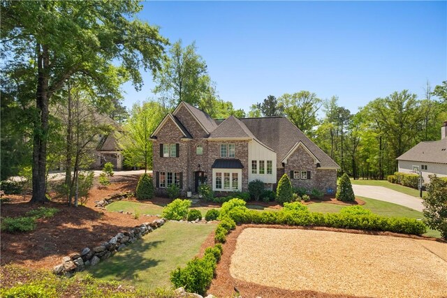 1321 Falls Crest Dr, Auburn, AL 36830 - view of front of home with board and batten siding, stone siding, and a front lawn