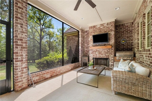1321 Falls Crest Dr, Auburn, AL 36830 - sunroom / solarium featuring plenty of natural light, an outdoor living space with a fireplace, and a ceiling fan