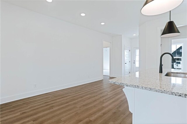 13 Crossing Ct E, Valley, AL 36854 - unfurnished living room featuring wood finished floors and recessed lighting