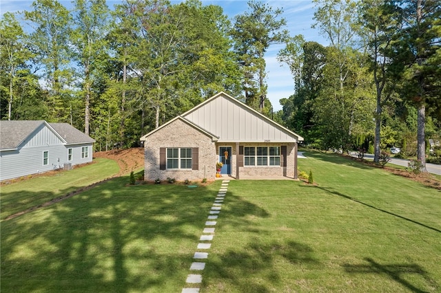 view of front of house featuring a front yard and a porch