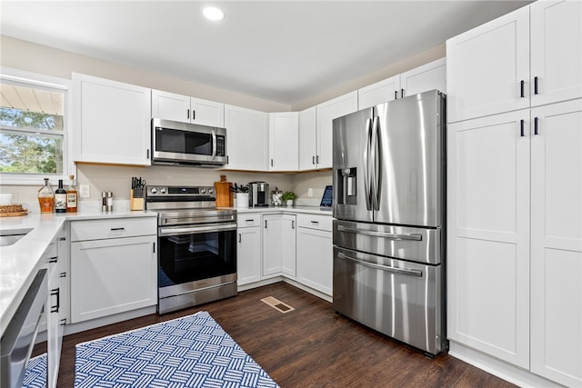 573 Hudson Ter, Auburn, AL 36830 - kitchen featuring appliances with stainless steel finishes, light countertops, dark wood-style flooring, white cabinets, and recessed lighting