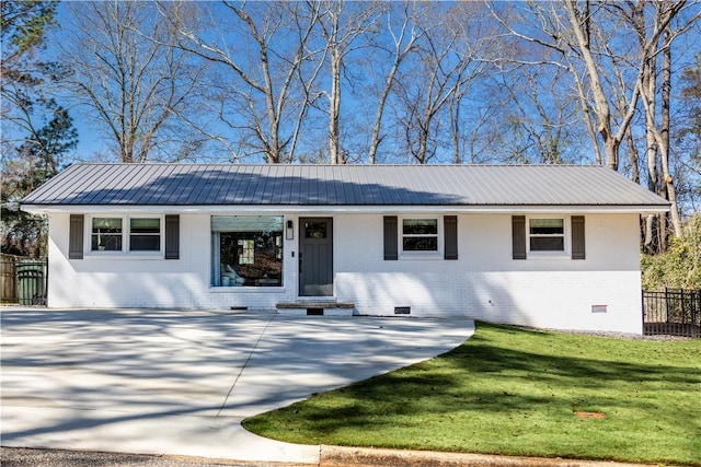 573 Hudson Ter, Auburn, AL 36830 - view of front of property featuring crawl space, brick siding, metal roof, and concrete driveway