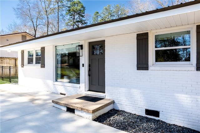 573 Hudson Ter, Auburn, AL 36830 - view of exterior entry featuring brick siding and crawl space