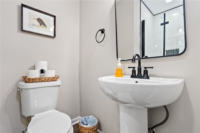 573 Hudson Ter, Auburn, AL 36830 - bathroom featuring toilet, baseboards, and a sink