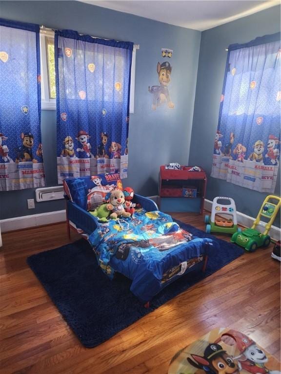 bedroom featuring wood-type flooring