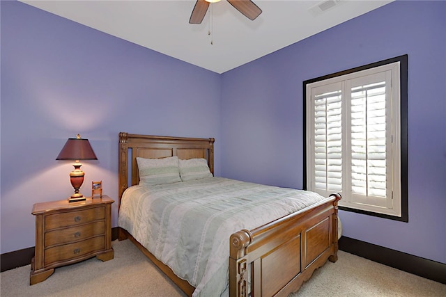 bedroom with ceiling fan, light carpet, and visible vents