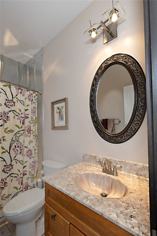full bath with toilet and vanity