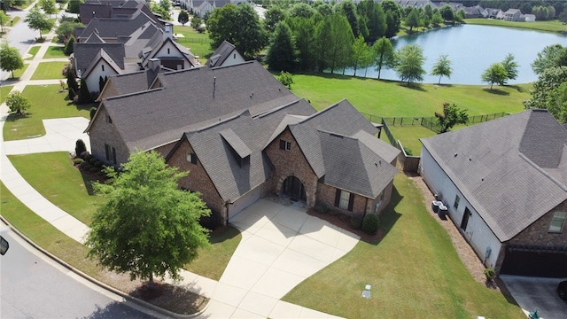 bird's eye view with a water view and a residential view