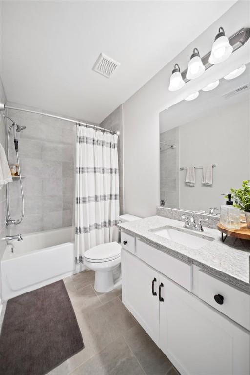 full bathroom featuring vanity, tile patterned floors, shower / bath combination with curtain, and toilet