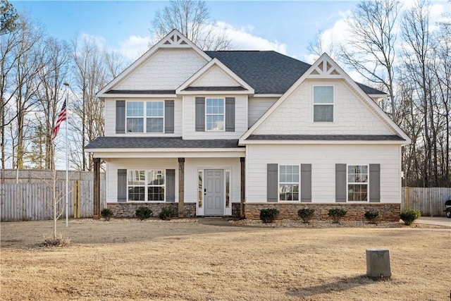 craftsman-style house featuring a front yard