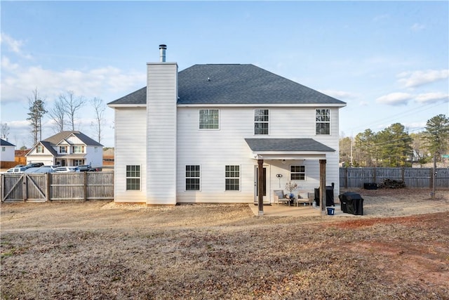 back of house featuring a patio