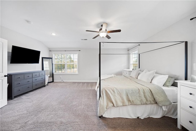 bedroom with lofted ceiling, light colored carpet, and ceiling fan