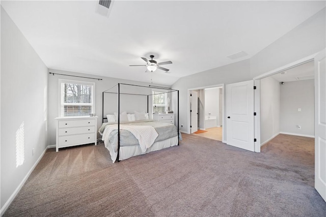 unfurnished bedroom with ensuite bath, carpet floors, ceiling fan, and vaulted ceiling