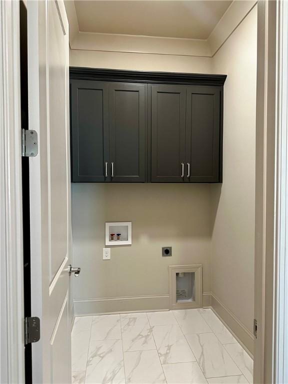 465 Windsor Dr, Opelika, AL 36801 - clothes washing area with electric dryer hookup, cabinet space, hookup for a washing machine, baseboards, and light marble finish flooring