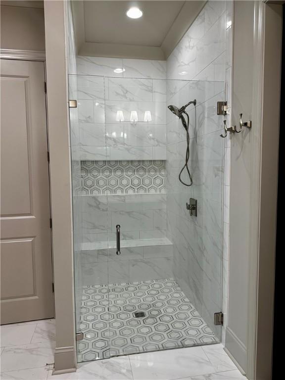 465 Windsor Dr, Opelika, AL 36801 - bathroom with marble look tile flooring, a shower stall, and recessed lighting