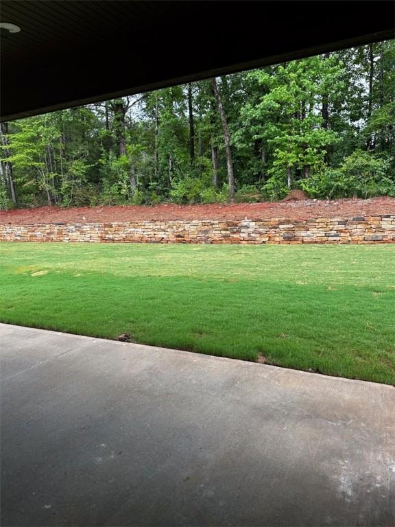 465 Windsor Dr, Opelika, AL 36801 - view of green lawn featuring a patio