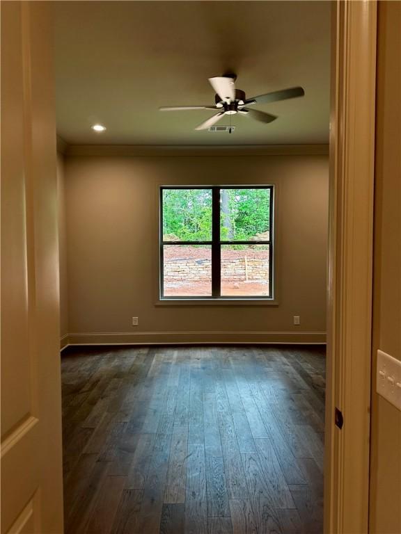 465 Windsor Dr, Opelika, AL 36801 - spare room with dark wood finished floors, a ceiling fan, ornamental molding, baseboards, and recessed lighting
