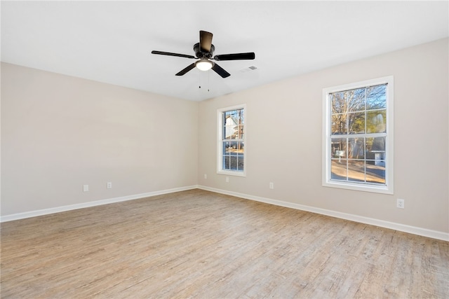 1039 Cornstalk Ln, Auburn, AL 36830 - spare room with visible vents, baseboards, ceiling fan, and light wood-type flooring