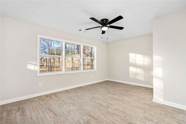 1039 Cornstalk Ln, Auburn, AL 36830 - spare room featuring wood finished floors, baseboards, and visible vents