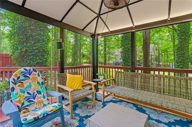 wooden deck featuring a gazebo and an outdoor living space