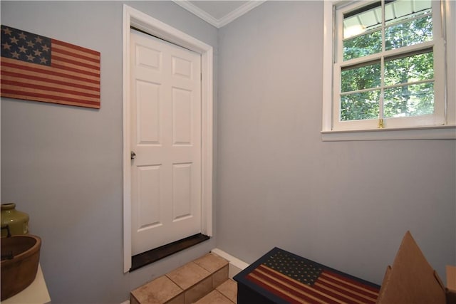 interior space with tile patterned floors and ornamental molding