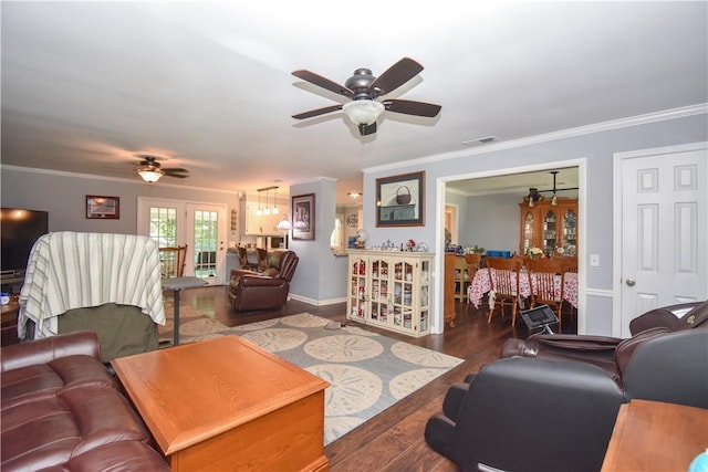 living room featuring hardwood / wood-style floors, ceiling fan, and ornamental molding