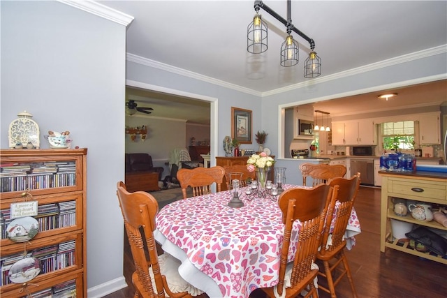 dining area with crown molding, ceiling fan, and dark wood-type flooring