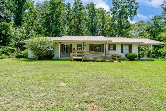 ranch-style home with a front yard, a porch, and a carport