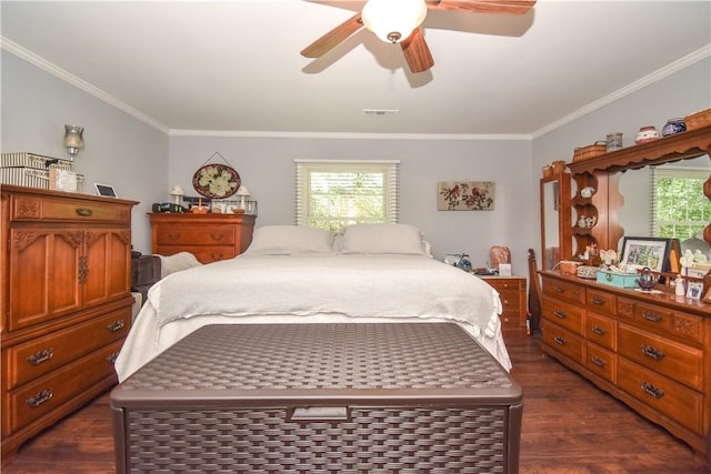 bedroom with dark hardwood / wood-style floors, ceiling fan, and crown molding