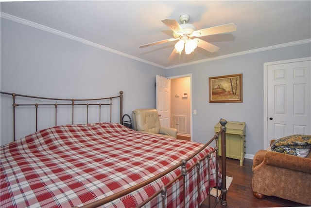 bedroom with dark hardwood / wood-style flooring, ceiling fan, and ornamental molding