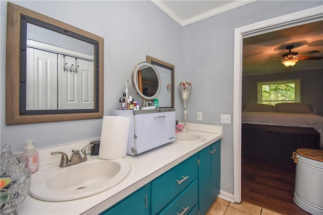 bathroom featuring tile patterned floors, ceiling fan, ornamental molding, and vanity