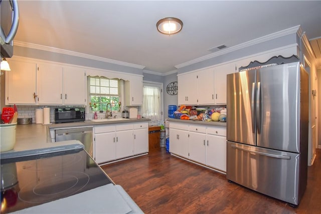 kitchen featuring white cabinets and appliances with stainless steel finishes