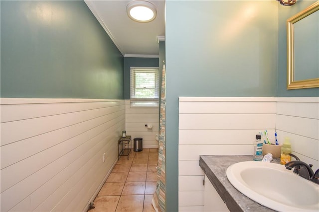 bathroom featuring tile patterned flooring, vanity, and ornamental molding