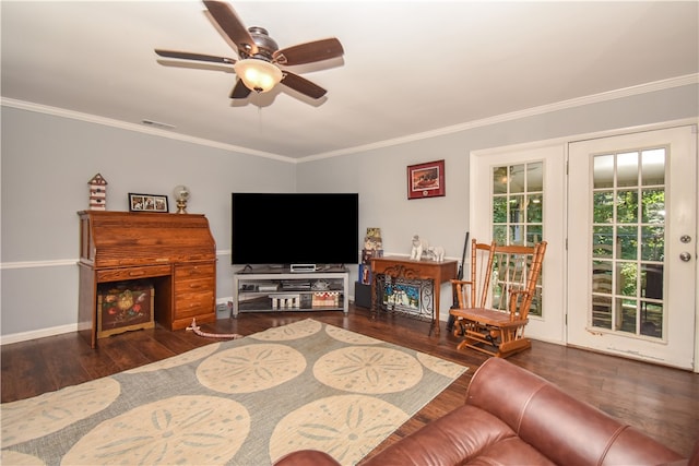 living room featuring ornamental molding, ceiling fan, and dark wood-type flooring