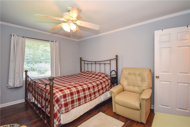 bedroom featuring ceiling fan, dark hardwood / wood-style flooring, and crown molding