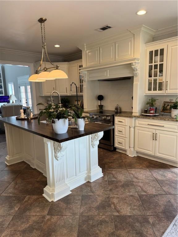 6207 County Road 222, Five Points, AL 36855 - kitchen featuring electric range, dark countertops, glass insert cabinets, decorative backsplash, and ornamental molding
