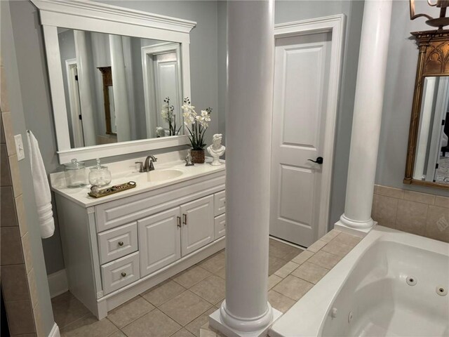 6207 County Road 222, Five Points, AL 36855 - bathroom with a jetted tub, vanity, tile patterned flooring, and ornate columns