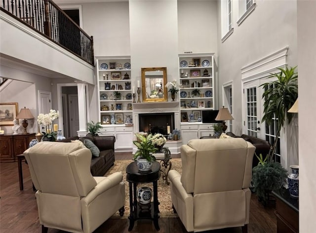 6207 County Road 222, Five Points, AL 36855 - living area featuring a towering ceiling, built in features, and dark wood finished floors