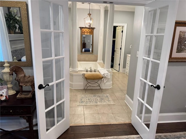 6207 County Road 222, Five Points, AL 36855 - bathroom featuring a bath, decorative columns, french doors, tile patterned flooring, and a chandelier