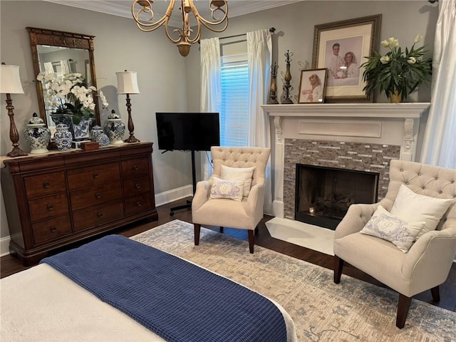 6207 County Road 222, Five Points, AL 36855 - bedroom with ornamental molding, a chandelier, baseboards, wood finished floors, and a fireplace
