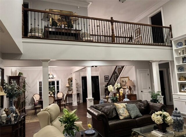 6207 County Road 222, Five Points, AL 36855 - living room with ornate columns, ornamental molding, wood finished floors, a towering ceiling, and stairway