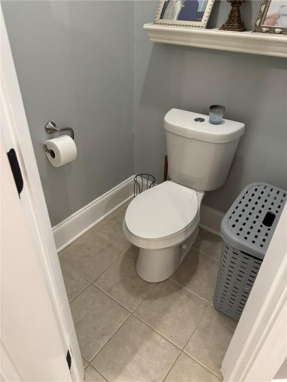 6207 County Road 222, Five Points, AL 36855 - bathroom featuring toilet, tile patterned flooring, and baseboards