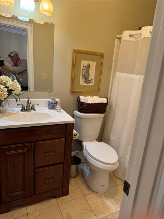 6207 County Road 222, Five Points, AL 36855 - bathroom with vanity, tile patterned floors, toilet, and a shower with curtain