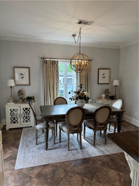 6207 County Road 222, Five Points, AL 36855 - dining area with a chandelier, crown molding, and baseboards
